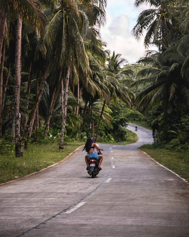Motorbike ride on a quiet island road in Siargao